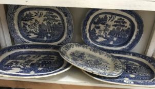 5 blue and white willow pattern meat platters.