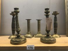 3 pairs of brass candlesticks.