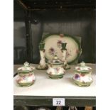 A Staffordshire pottery trinket set.