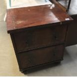A Victorian mahogany veneered 2 drawer chest.