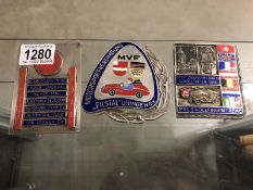 A 1931 Lubeck and a 1966 Sindelfingen ADAC German vintage enamel car rally plaques and one other.