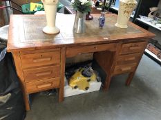 A 1950s double pedestal desk with leather insert.