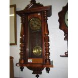 A mahogany wall clock.