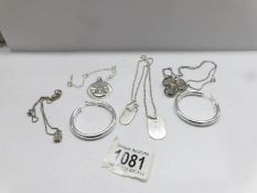 4 silver pendants and a pair of silver earrings, 42 grams.