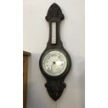 An Edwardian oak barometer with silvered dial glass a/f.