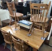 A pine kitchen table and 6 chairs.