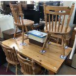 A pine kitchen table and 6 chairs.