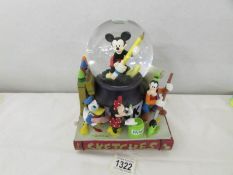 An official Walt Disney Mickey/Goofy snow dome.