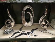 A set of 3 modern chrome sculptures and other chrome items.