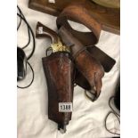 A replica navy colt with leather holster and case.