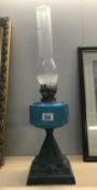 A Victorian oil lamp with blue glass font, burner a/f.