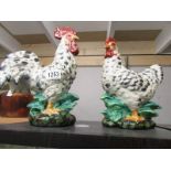 A pottery hen and a pottery cockerel.