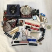 A small box of various cosmetics.