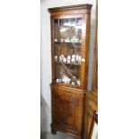 A mahogany astragal glazed corner cabinet.