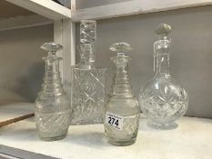 A pair of liqueur decanters and 2 cut glass decanters.