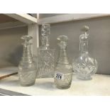 A pair of liqueur decanters and 2 cut glass decanters.