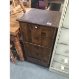 A vintage leather covered filing chest/music cabinet.