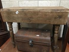 A wooden drop-leaf table.