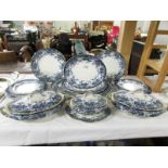 A 19th century blue and white dinner set comprising 5 graduated meat platters, 3 lidded tureens,