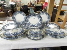 A 19th century blue and white dinner set comprising 5 graduated meat platters, 3 lidded tureens,