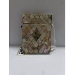 A mother of pearl card case.