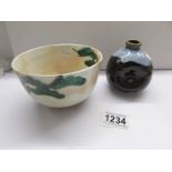 A Japanese bowl and a glazed sake' vessel.