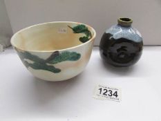 A Japanese bowl and a glazed sake' vessel.