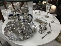 A collection of silver plate including tea set, goblets, condiment items etc.