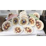 4 sets of 3 plates decorated with fruit consisting of plums and grapes (2 signed D.