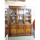 A mahogany astragal glazed book case.