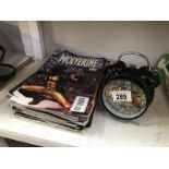 A quantity of Marvel magazines including Wolverine, Captain America and Hulk, plus a Marvel clock.