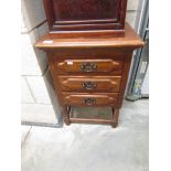 A 3 drawer oak chest.