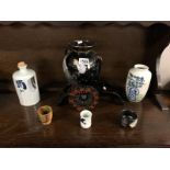 A Japanese vase, a Sake' bottle, 3 Sake' cups and an Oriental vase on cart stand.