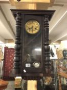 A mahogany wall clock.