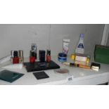 A shelf of assorted cosmetics etc.