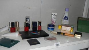 A shelf of assorted cosmetics etc.
