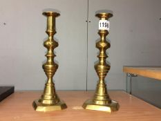 A pair of brass candlesticks.