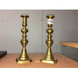 A pair of brass candlesticks.