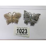 2 jewelled butterfly brooches.