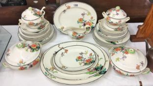 A collection of Copeland Spode Kymono 1932 dinnerware including plates, platters, tureens etc.