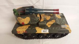 A Japanese battery operated toy tank with logo mark for YONEZAWA.