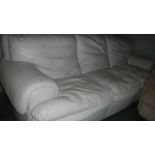 A 3 seat cream leather sofa.