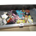 A large box of costume jewellery.