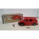 A boxed Triang minic fire engine.