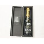 A cased bottle of Moet & Chandon 2004 Grand Vintage champagne.