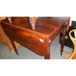 A mahogany Pembroke table.