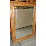 A gilt framed mirror.