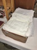 A box of vintage household linens/textiles and a boxed vintage blouse.
