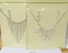 2 fashion necklaces with matching earrings.