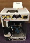 A signed by Ben Affleck Knightmare Batman Pop! vinyl figurine in box.